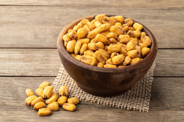 Fried corn in a bowl over wooden table
