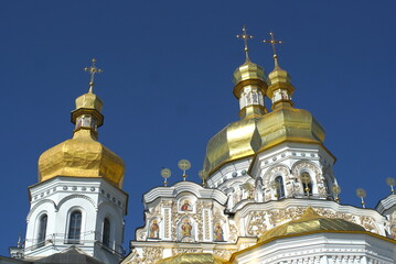 Fototapeta na wymiar church with golden domes on sky background 