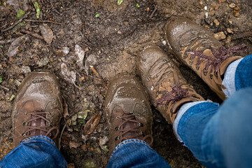 2 people with muddy boots