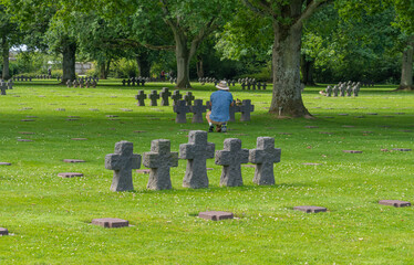Naklejka premium La Cambe, France - 08 03 2021: Normandy German military cemetery and Memorial and the black crosses