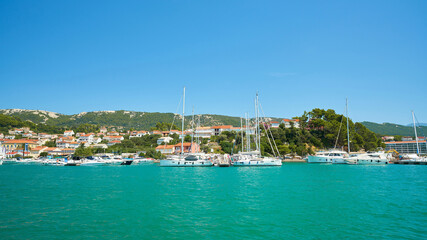 Fototapeta na wymiar View of the port of the island of Rab with the town of the same name on the Adriatic Sea in Croatia