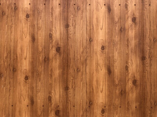 Naklejka premium brown background made of vertical wooden boards