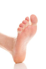 Foot with silicone separator on white background.
