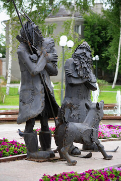 Tobolsk, Russia. Monument To Robinson Crusoe, Friday And Dog Laika. The Monument To The Heroes Of The Novels By Daniel Defoe Was Unveiled In 2007.