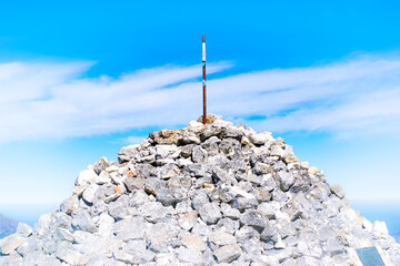 Maclear's Beacon on top of Table Mountain against bright blue sky