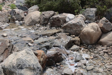 Water Splashing over Rock in a Small Stream with very interesting Water Artifacts