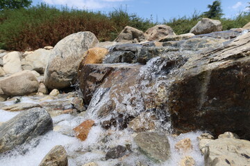 Water Splashing over Rock in a Small Stream with very interesting Water Artifacts