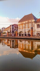 reflection of houses on the river