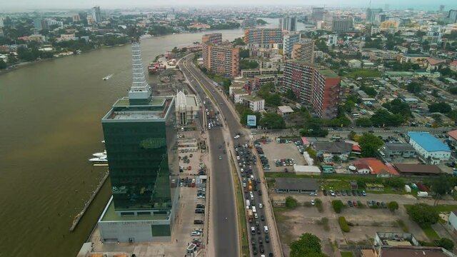 Traffic and cityscape of Falomo Bridge, Lagos Law school and the Civic centre tower in Lagos Nigeria