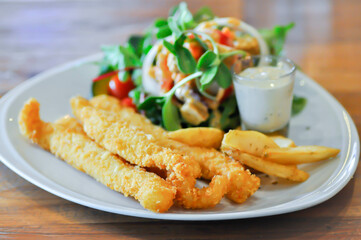 fish and chip or fried fish with French fries and salad