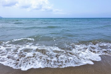 blue sky and sea with waves