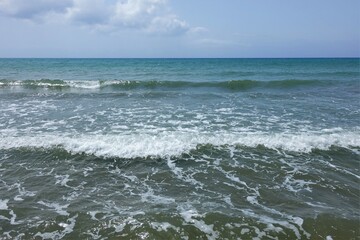 blue sky and sea with waves