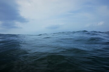 blue sky and sea with waves