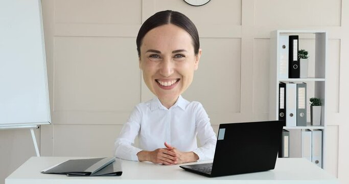 Portrait of smiling businesswoman with small body and huge oversized face at office