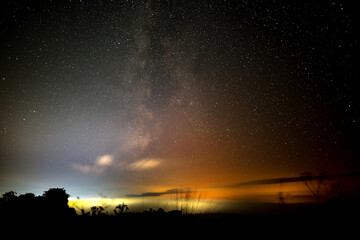 Fototapeta na wymiar The Milky Way over the fog covered town of Penrith in the English Lake District