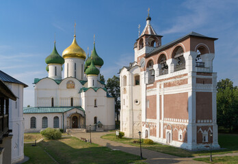 Fototapeta na wymiar Transfiguration Cathedral and bell tower (belfry) in Monastery of Saint Euthymius. Suzdal, Russia