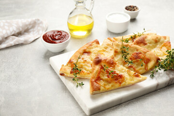 Delicious khachapuri with cheese on light table