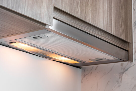 Close-up On Under Cabinet Range Hood, Exhaust Vent Hood In Kitchen.