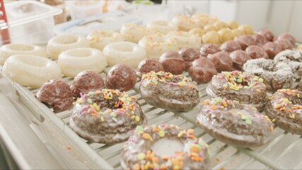 many donuts on a display rack