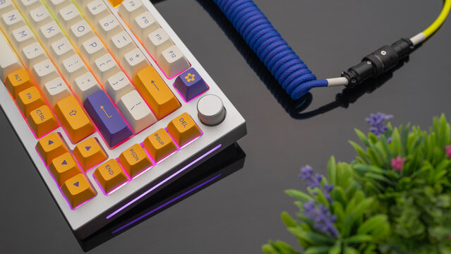 A premium Alluminium RGB mechanical gaming keyboard with with a stylish coiled USB cable with aviator connector