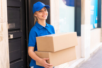 Young delivery woman at outdoors
