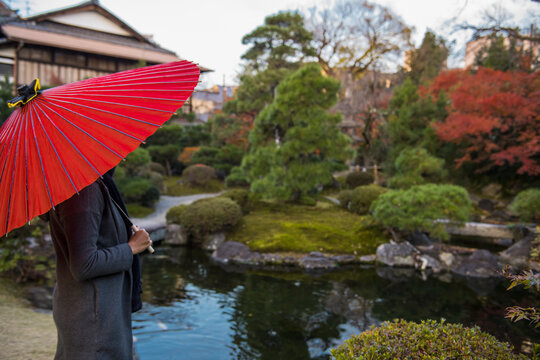 woman admiring traditional Japanese zen garden in Kyoto
