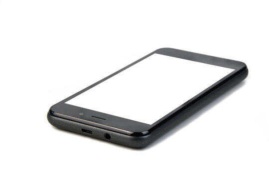 dark gray smartphone on a white background, free space in place of the screen, focus on the foreground