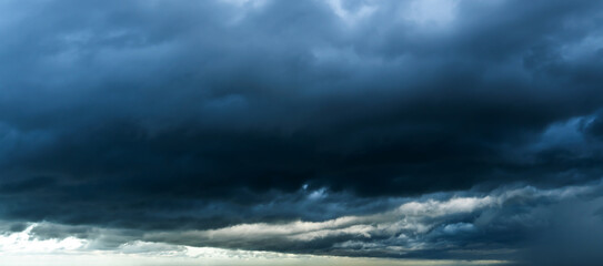 Fototapeta premium Storm sky with dark grey cumulus clouds background texture, thunderstorm