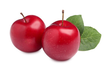 Delicious ripe cherry plums with leaves on white background