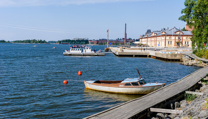 Naklejka na ściany i meble Vaasa harborfront with the old harbormaster building and several boats at the docks