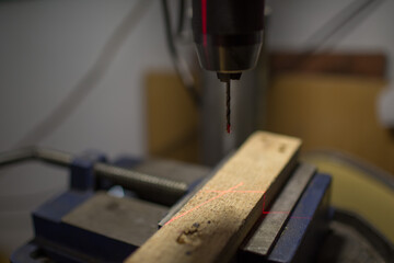Drilling machine with laser sight in the workshop