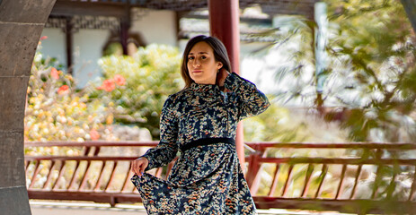 Portrait of Italian young girl posing in Chinese garden in Malta