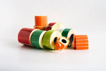 Multi-colored self-adhesive labels in label rolls for thermal transfer printer. Various forms for...