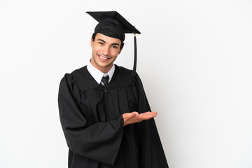 Young university graduate over isolated white background presenting an idea while looking smiling towards