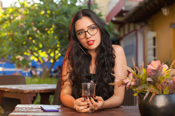 Woman outdoors drinking tea
