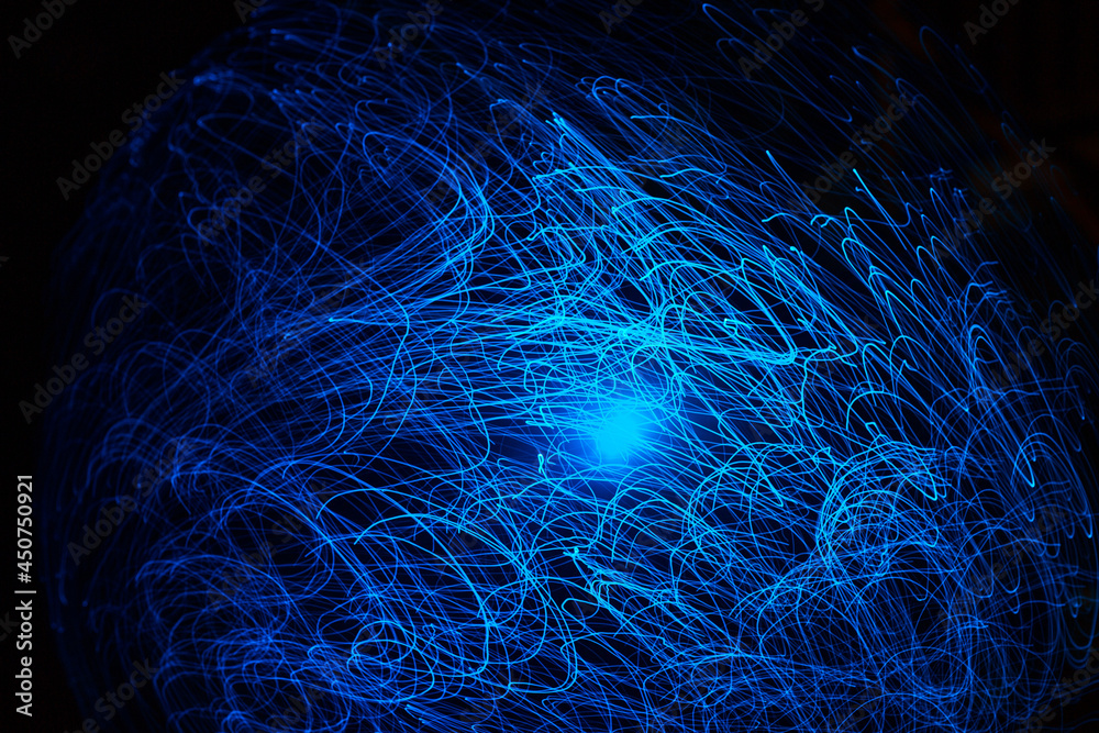 Wall mural blue abstract particles and lines with bokeh and blur in dark background.