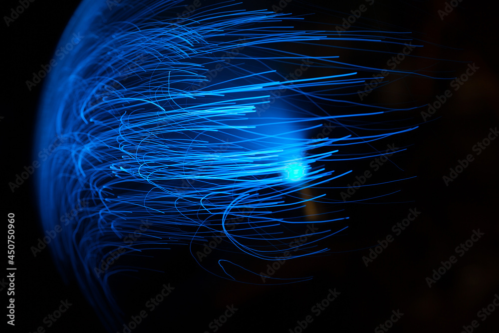Wall mural blue abstract particles and lines with bokeh and blur in dark background.
