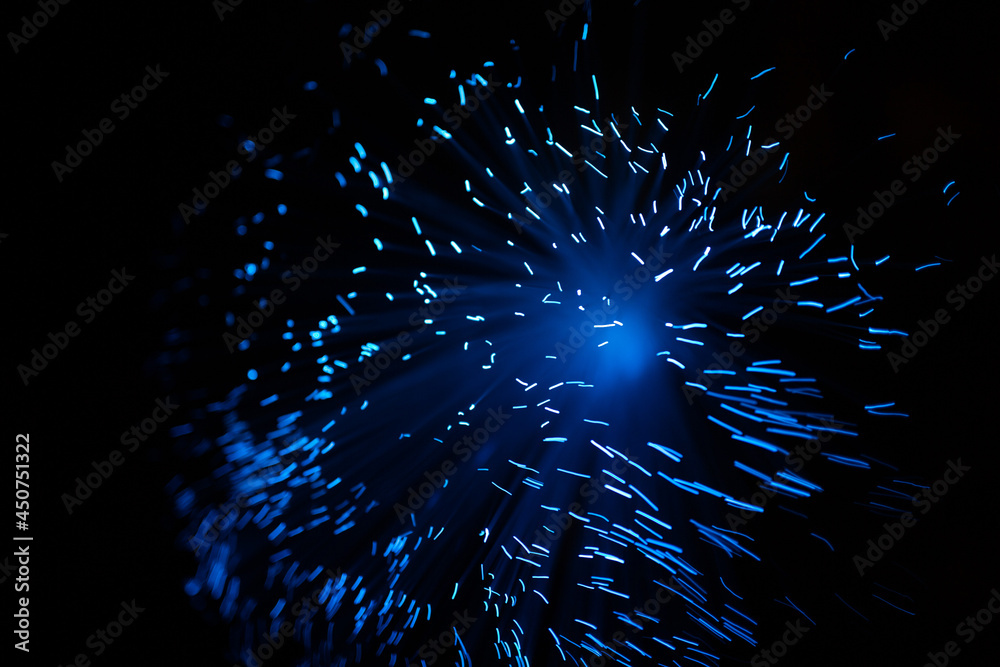 Wall mural blue abstract particles and lines with bokeh and blur in dark background.