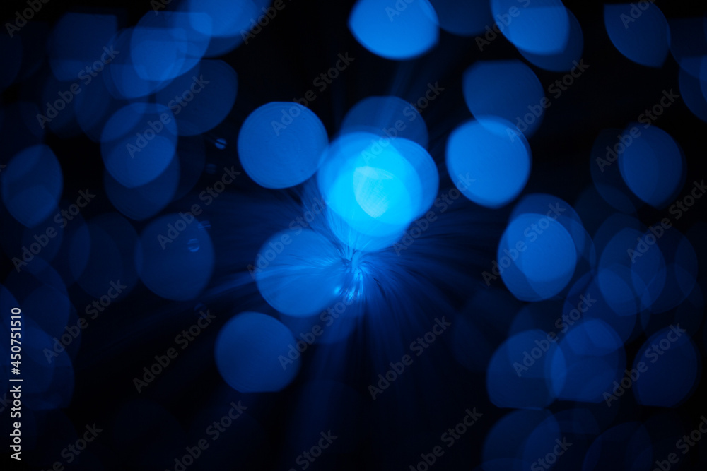 Wall mural blue abstract particles and lines with bokeh and blur in dark background.