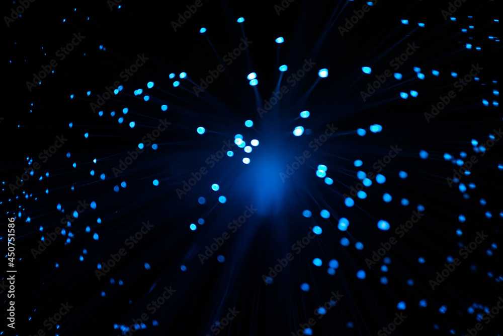 Wall mural blue abstract particles and lines with bokeh and blur in dark background.