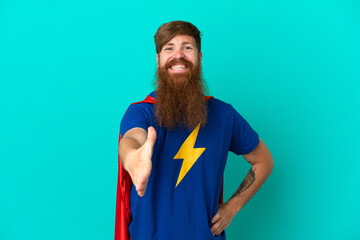 Redhead man in superhero costume and making a deal