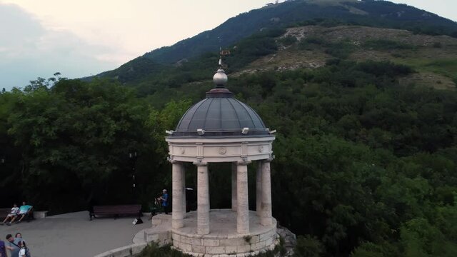 A drone flight over an ancient building at sunset in Pyatigorsk. The mountains