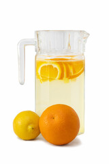 Isolated on a white background is a jug with homemade lemonade, an orange and a lemon.