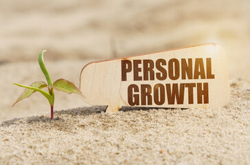 Near the sprout there is a plate with the inscription - PERSONAL GROWTH