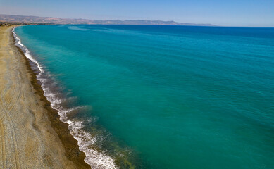 Fototapeta na wymiar Aerial drone scenery of the coastline seascape with sandy beautiful beach. Paphos Cyprus