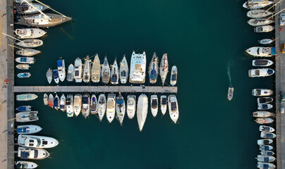 Aerial view of fishing boats and tourist yachts moored at the marina. Latsi harbor Paphos Cyprus