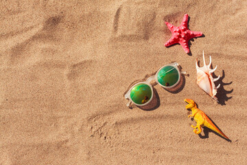 Summer or holiday beach vacation background, travel to the sea with kids. Ocean accessories on...