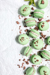 Homemade mint chocolate chip macarons with a mint buttercream filling