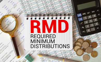 Desktop office desk, notebook, glasses, pen and documents with RMD require minimal distribution on...