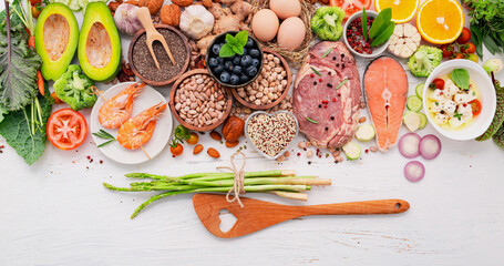 Ketogenic low carbs diet concept. Ingredients for healthy foods selection set up on white wooden background.